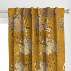 the curtains are decorated with birds on yellow