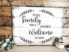 a wooden sign that says every family has a story welcome to ours