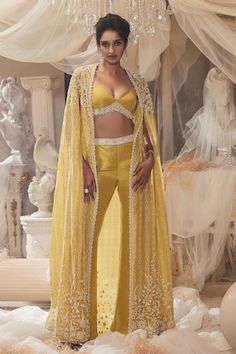 Yellow cape with ivory pearl, cutdana, sequin embroidery in floral pattern. Paired with border embroidered bustier and pant. - Aza Fashions Pearl Cape, Dandelion Yellow, Blue Cape, Pearl Embroidery, Satin Pants, Sleepover Party, Sequins Embroidery, Silk Embroidery, Yellow Fabric