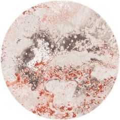 an orange and white circular painting on a white surface with red paint splatters all over it