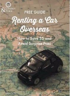 a toy car sitting on top of a map with the words free guide renting a car