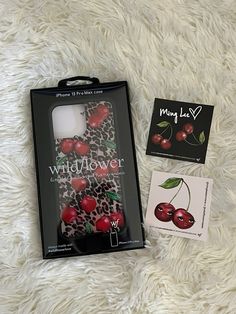 the packaging for wildflower has cherries on it and is next to an unopened card