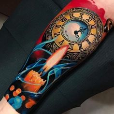 a person with a clock tattoo on their arm holding a red object in front of him