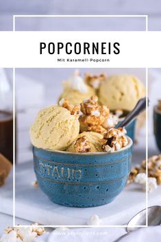 a blue bowl filled with ice cream and popcorn