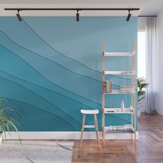 a blue wall mural with wavy lines on it