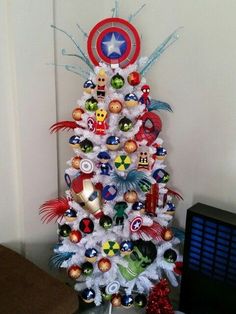 a white christmas tree decorated with captain america ornaments