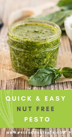 a jar filled with pesto sitting on top of a wooden table