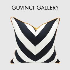 a black and white striped pillow with the words guvini gallery on it's side