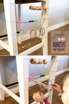 a child playing with an abacus toy on top of a wooden shelf in the living room