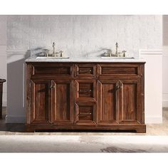 a bathroom vanity with two sinks in it