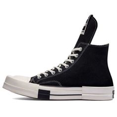 Looking for a high-top sneaker with a punk couture aesthetic? Check out the Converse Rick Owens DRKSHDW x Turbodrk Chuck Taylor All Star 1970s High in black. This sneaker is made from waxed textile with contrast white stitching and a standard All Star patch on the medial ankle. It also features an elongated tongue with a TURBODRK-branded woven tag. The high-top rides on an off-white rubber midsole, making it super comfortable to wear all day long. Plus, the squared off toe gives this sneaker a unique look that you'll love. (SNKR/Unisex/High Top/Crossover) Canvas High-top Sneakers For Streetwear, Black High-top Sneakers With Rubber Heel Cap For Streetwear, Modern Canvas High-top Sneakers For Streetwear, Canvas High-top Sneakers For Streetwear With Boost Midsole, Streetwear High-top Sneakers With Rubber Heel Cap, High-top Sneakers With Rubber Heel Cap For Streetwear, Custom High-top Sneakers With Rubber Toe Cap For Streetwear, Custom Converse High-top Sneakers For Streetwear, Streetwear High-top Sneakers With Rubber Toe Cap