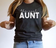 Aunts are what make the world go round so this aunt shirt is the best funny aunt gift to give your sister to show she is the myth, the woman, the legend for being an aunt. This is a great cotton tshirt to wear for spending the day with your nieces and nephews! Check out other items in our shop from this collection. All graphics can be put on another item in our shop and most items come in a variety of colors. Please don't hesitate to reach out to us about any customizations. * P L E A S E R E A Being An Aunt, The Cool Aunt, Best Aunt Ever, Cool Aunt, Auntie Shirts, Best Aunt, Auntie Gifts