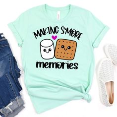 a t - shirt that says making smore memories next to a pair of jeans