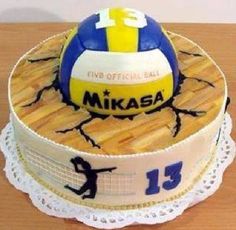 a birthday cake with a volleyball on it