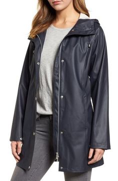 Designed in Scandinavia, this classic slicker will keep you dry and comfortable during storms and showers with its waterproof finish and drawcord hood. 32" length (size 34) Front snap closure Drawcord hood Long sleeves Front slash pockets Lined 100% polyurethane with 100% polyester contrast Machine wash, line dry Imported Coats Classic Waterproof Raincoat For Fall, Classic Outerwear For Rainy Weather, Solid Raincoat With Detachable Hood For Rainy Weather, Spring Weatherproof Parka For Rainy Weather, Solid Raincoat With Drawstring Hood, Spring Raincoat With Double-lined Hood For Rainy Weather, Solid Raincoat With Drawstring Hood For Rainy Weather, Double-lined Hood Parka For Rainy Season, Classic Weatherproof Winter Raincoat