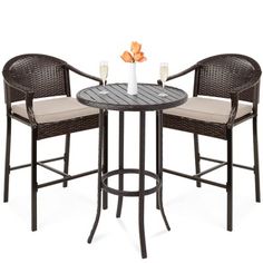 three chairs and a table with drinks on it