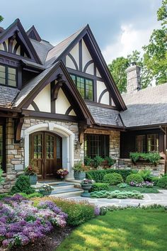 a beautiful house with lots of flowers in the front yard