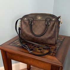 Coach Signature Mini Bag, Barely Used In Great Condition Formal Brown Satchel With Branded Hardware, Brown Satchel With Branded Hardware And Double Handles, Brown Coated Canvas Satchel With Gold-tone Hardware, Brown Shoulder Satchel With Branded Hardware, Brown Coated Canvas Satchel With Detachable Strap, Brown Crossbody Satchel With Branded Hardware, Brown Coated Canvas Crossbody Satchel, Brown Coach Satchel For Evening, Coach Brown Coated Canvas Satchel