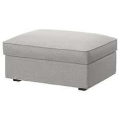 a grey ottoman that is sitting on the ground