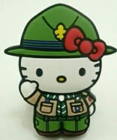 a hello kitty pin with a green hat on it's head and an army uniform