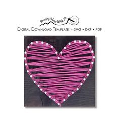 a pink heart shaped string art project