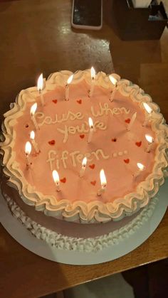 a birthday cake with lit candles that says, i love you're fifteen years old