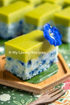 a piece of cake sitting on top of a wooden plate