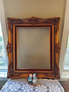 a pair of shoes sitting on top of a table in front of a large mirror