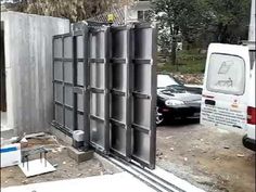 a white van parked next to a building under construction