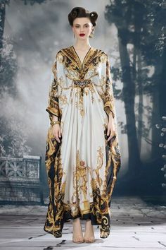 Black and gold silk long kaftan with all over regal prints. - Aza Fashions Silk Kaftan With Traditional Drape For Evening, Silk Kaftan For Evening With Traditional Drape, Gold Silk Kaftan For Festive Season, Gold Kaftan With Traditional Drape For Party, Gold Kaftan For Party With Traditional Drape, Festive Gold Silk Kaftan, Gold Embroidered Kaftan With Traditional Drape, Elegant Silk Floor-length Kaftan For Evening, Silk Floor-length Kaftan For Formal Occasions