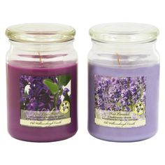 two candles with lavender flowers in them