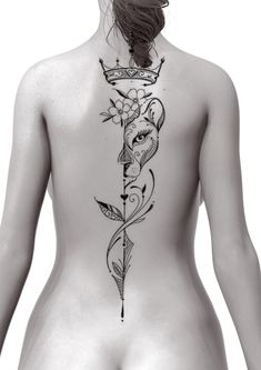 the back of a woman's body with tattoos on it