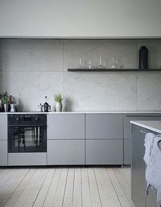 a kitchen with an oven, dishwasher and counter top in it's center