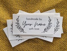 "Personalized fabric labels for handmade items, printed on natural GOTS certified 100% organic cotton with your name or text and a modern hand-drawn botanical laurel graphic.  These labels are clean, simple, and elegant; they're the perfect finishing touch to your handmade items or branding for your small sewing business. We print them on the bias of a very finely woven twill-weight cotton with CPSIA compliant eco-friendly inks; they won't fade away or unravel.   Because we don't use iron transf