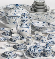 a collection of blue and white china