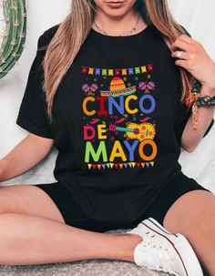 🎉 Get ready to fiesta in style with our vibrant Cinco De Mayo t-shirt! Made with ultra-soft Bella Canvas fabric, this shirt ensures both comfort and quality. Featuring a festive design inspired by the celebration of Mexican heritage and culture, it's the perfect attire for parties, gatherings, or simply showing off your love for the holiday. Whether you're sipping margaritas or indulging in delicious tacos, this shirt is sure to add a dash of flair to your festivities. Grab yours now and let th Cinco De Mayo Graphic Tee With Short Sleeves, Cinco De Mayo Graphic T-shirt, Pre-shrunk Short Sleeve T-shirt For Cinco De Mayo, Casual Multicolor Shirt For Cinco De Mayo, Fun Cinco De Mayo Tops With Funny Print, Fun Cinco De Mayo Funny Print Tops, Cinco De Mayo Funny Print Crew Neck T-shirt, Cinco De Mayo Graphic Print T-shirt, Casual Cinco De Mayo T-shirt With Funny Print