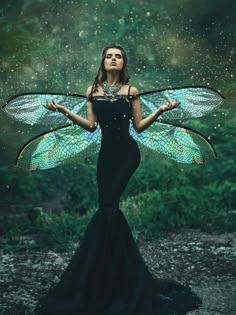 a woman dressed as a fairy with wings