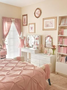 a bedroom decorated in pink and white with pictures on the wall above the dressers