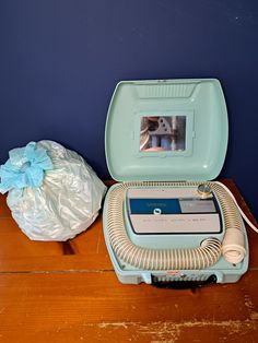 "Tested and Working! What a wonderful vintage hair dryer. This is a two in one dryer with a bonnet for your hair and a nail dryer area. This portable hair dryer comes with a spot to add perfume to scent your hair, a mirror and different temperature settings. The case and overall color scheme is a light teal blue, we refer to the color as Barbie Blue! The carrying case is a hard shell and has a latch that closes and locks.  Clean and ready to use/display. Great vintage piece!  Measurements are ap 1950s Hair, Vintage Hair Dryer, 1950s Hairstyles, Portable Hair Dryer, Nail Dryer, Vintage Hair, Light Teal, Vintage Hairstyles, Carrying Case