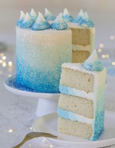 two pieces of blue and white cake on a plate