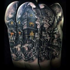 a man's arm with an image of a house in the woods on it