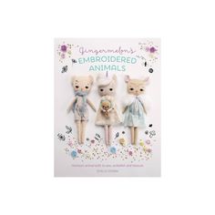 three stuffed animals are standing next to each other on the cover of a book,