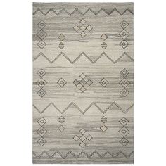 a gray and white rug with geometric designs on the front, in two different colors