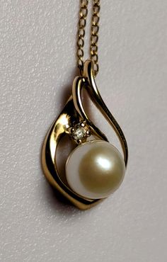 Beautiful 18k yellow gold tear drop pendant with a pearl and diamond. Yellow gold 12K Gold Filled 16 inch chain. Approximate weight of 2 grams. Pendant is approximately 18 mm high and 9.5 mm wide.  Free shipping. Yellow Gold Teardrop Necklace With Pearl Pendant, Gold Teardrop Pendant Pearl Necklace For Formal Occasions, Gold Teardrop Pendant Pearl Necklace For Formal Events, Yellow Gold Teardrop Pearl Necklace For Formal Occasions, Elegant Teardrop Yellow Gold Pearl Necklace, Elegant Yellow Gold Teardrop Pearl Necklace, Formal Teardrop Yellow Gold Pearl Necklace, Formal Yellow Gold Teardrop Pearl Necklace, Gold Teardrop Pendant Pearl Necklace For Anniversary