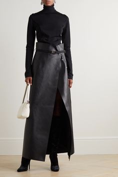 Givenchy's maxi skirt plays on extreme proportions with its floor-sweeping length and defining high waist. Debuted on the Fall '22 runway, it's made from smooth leather and cinches with a belt accented with the label's '4G' emblem. Mirror the show styling and leave the first few snap fastenings undone to create a dramatic split. Black Leather Maxi Skirt, Black Leather Maxi Skirt Outfit, Leather Long Skirt Outfit, Maxi Skirt Street Style, Long Leather Skirt Outfit, Leather Long Skirt, Maxi Leather Skirt, Leather Maxi Dress, Givenchy Belt