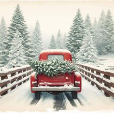 an old red truck with a christmas tree on the back driving down a snowy road