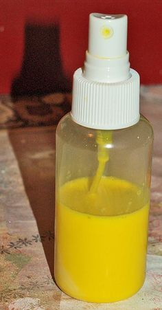 a yellow liquid bottle sitting on top of a table