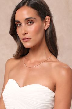 Whether you add it to your stack or style it solo, you'll shine with the Lulus Dainty Composure Gold Pearl Station Chain Necklace! Shiny, gold-toned metal shapes this sweet necklace that has elongated links and a super slender profile, with various groupings of glowing faux pearl beads along its length. Lobster clasp closure. 19" Long With A 3" Extender Chain. Man Made Materials. Made In China. Imported. Lulus | Dainty Composure Gold Pearl Station Chain Necklace. Feminine Rose Gold Necklace With Adjustable Chain, Rose Gold Delicate Chain Crystal Necklace, Rose Gold Crystal Necklace With Delicate Chain, Gold Single Strand Feminine Necklace, Adjustable Rose Gold Beaded Necklace, Feminine Gold Single Strand Necklace, Gold Dainty Crystal Necklaces For Party, Gold Dainty Crystal Necklace For Party, Dainty Necklace With Delicate Chain For Party