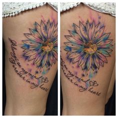 the back of a woman's thigh with flowers on it and words written in cursive writing