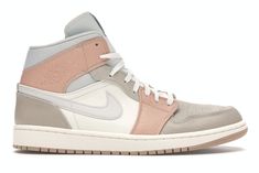 the nike air jordan 1 mid is available in grey, pink and white colorway